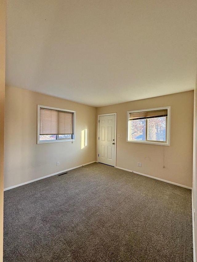 view of carpeted spare room