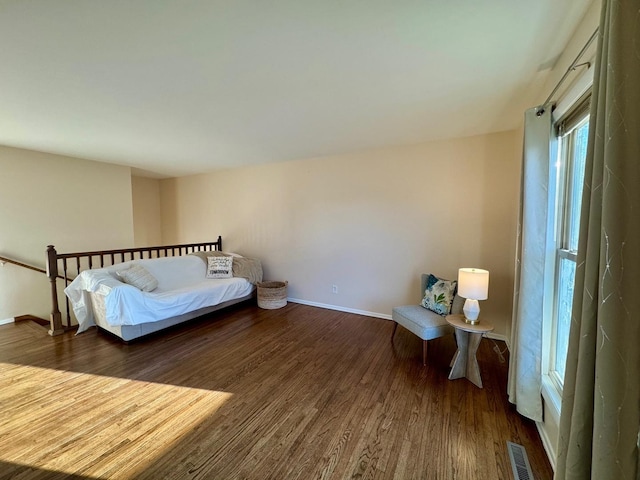 bedroom featuring dark wood-type flooring