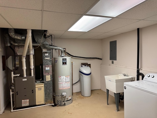 utility room featuring washer / dryer, electric panel, sink, gas water heater, and heating unit