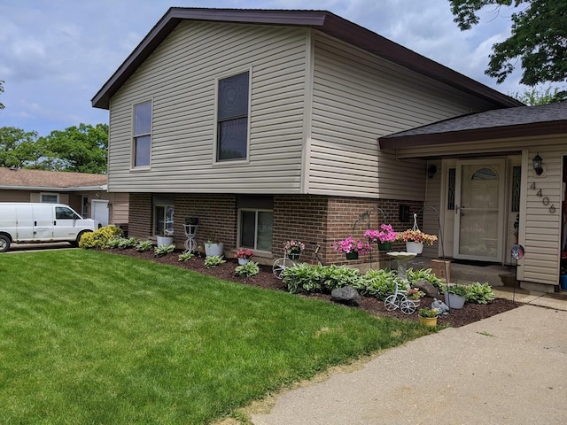 split level home with a front yard