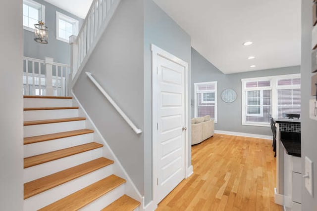 stairs with wood-type flooring