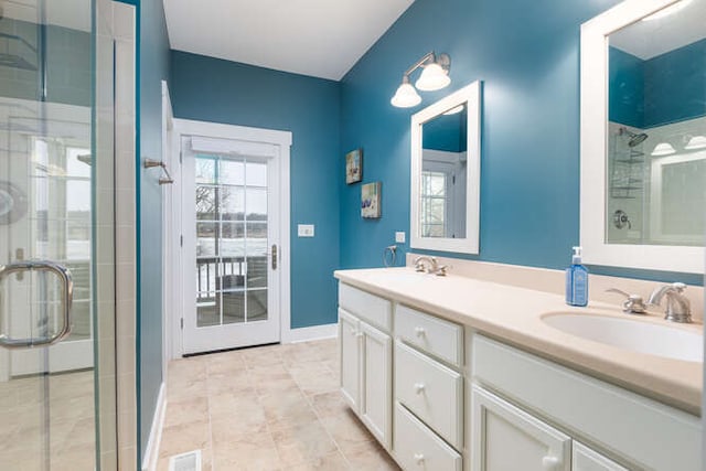 bathroom with vanity, tile patterned flooring, and walk in shower