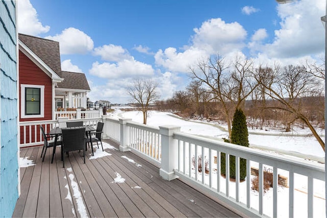 view of snow covered deck