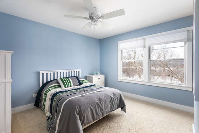 bedroom with ceiling fan and carpet flooring