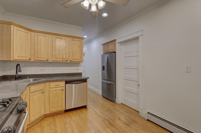 kitchen featuring appliances with stainless steel finishes, tasteful backsplash, a baseboard radiator, crown molding, and sink