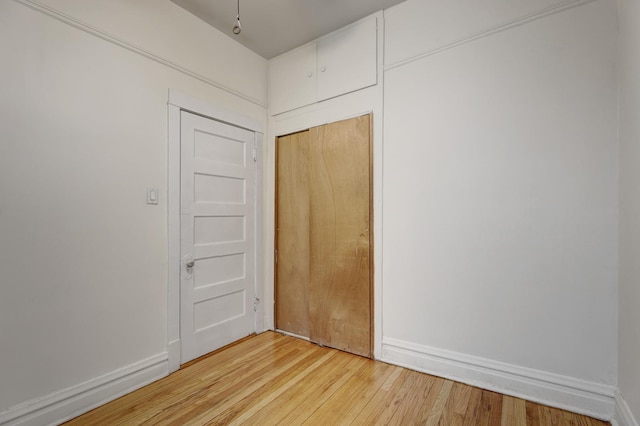 interior space with hardwood / wood-style flooring and a closet