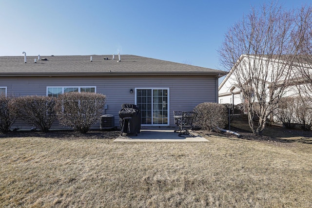 rear view of house featuring a patio and a lawn