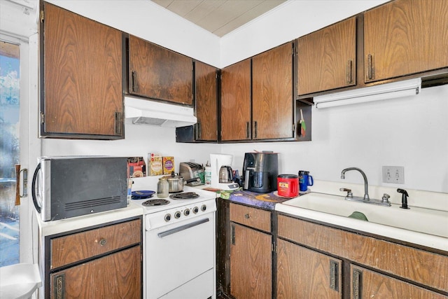 kitchen featuring sink and white electric range oven