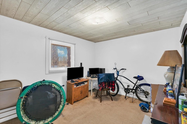 office space featuring light carpet and wood ceiling