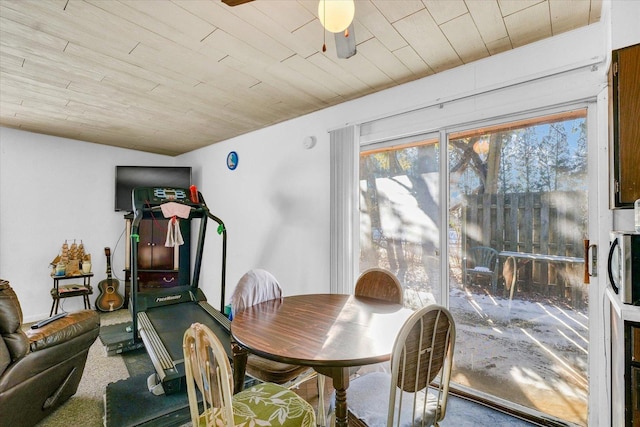 dining room featuring wooden ceiling and ceiling fan