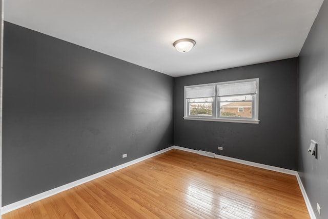 spare room featuring hardwood / wood-style flooring