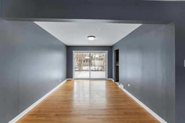 unfurnished room featuring light wood-type flooring