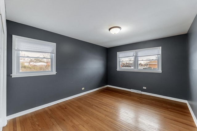 unfurnished room featuring wood-type flooring