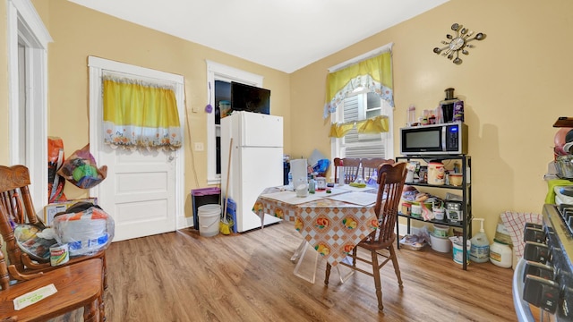 dining room with light wood-type flooring