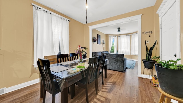 dining room with hardwood / wood-style floors