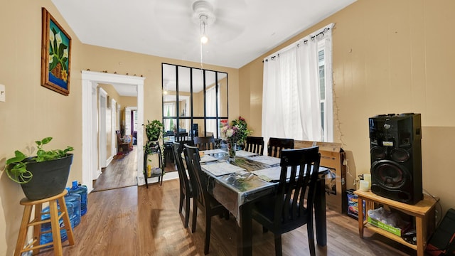 dining area with hardwood / wood-style flooring and ceiling fan