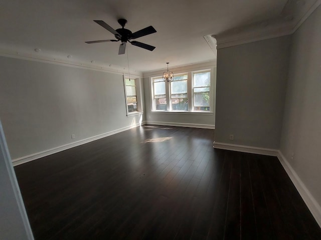 spare room featuring dark wood-type flooring, ceiling fan with notable chandelier, and crown molding