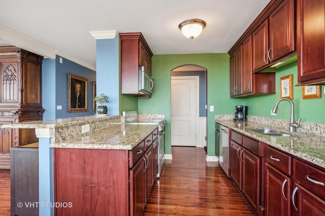 kitchen featuring light stone countertops, stainless steel appliances, crown molding, and sink