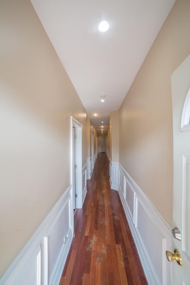 hall with dark wood-type flooring