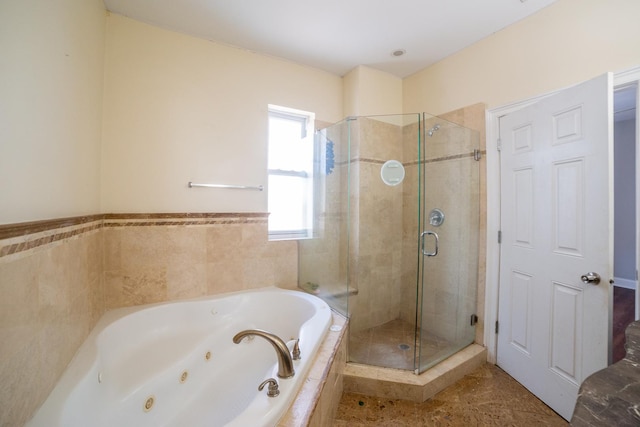 bathroom featuring tile patterned floors and shower with separate bathtub