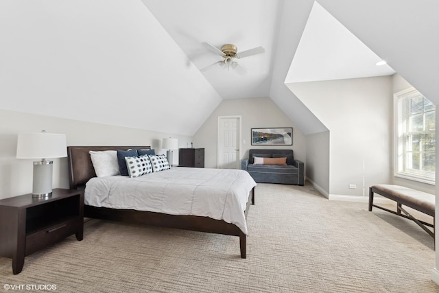 bedroom featuring ceiling fan, lofted ceiling, and light colored carpet