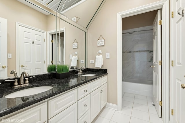 bathroom with vanity, tile patterned floors, and tiled shower / bath