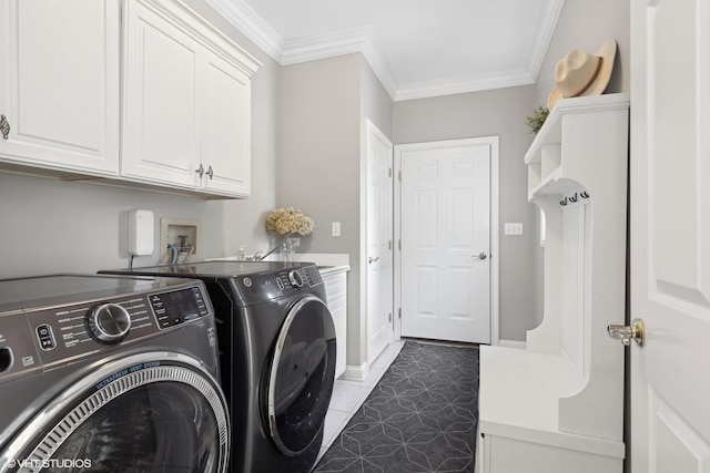 laundry room featuring cabinets, ornamental molding, tile patterned flooring, and washer and dryer