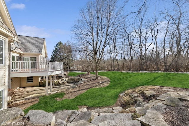 view of yard with a wooden deck