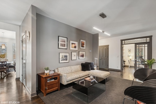 living room with dark hardwood / wood-style floors