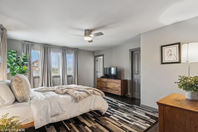 bedroom featuring dark hardwood / wood-style flooring and ceiling fan