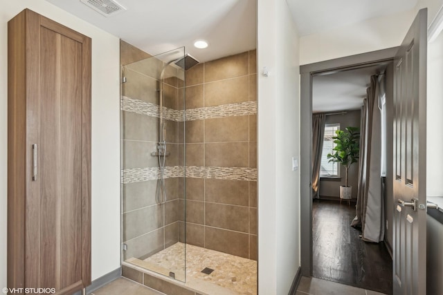 bathroom with a shower with shower door