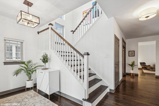 staircase featuring wood-type flooring