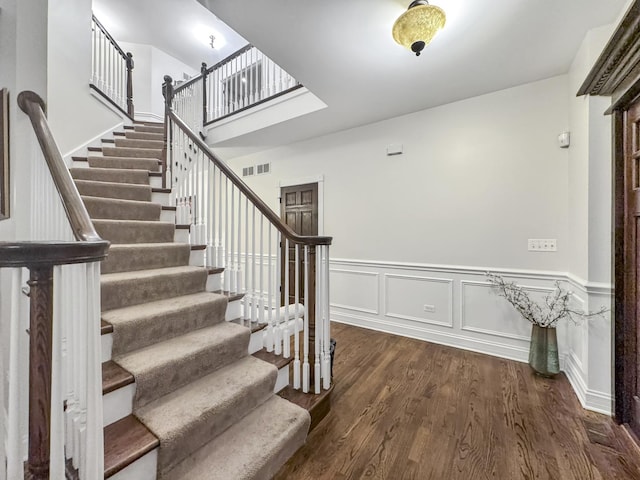 stairs with wood-type flooring