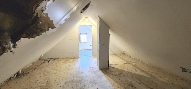 bonus room featuring vaulted ceiling