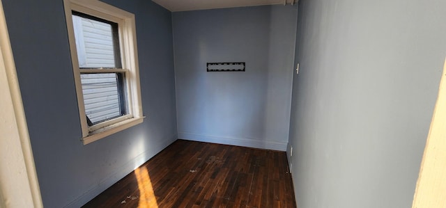 spare room featuring dark hardwood / wood-style floors