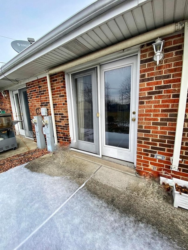 doorway to property with a patio