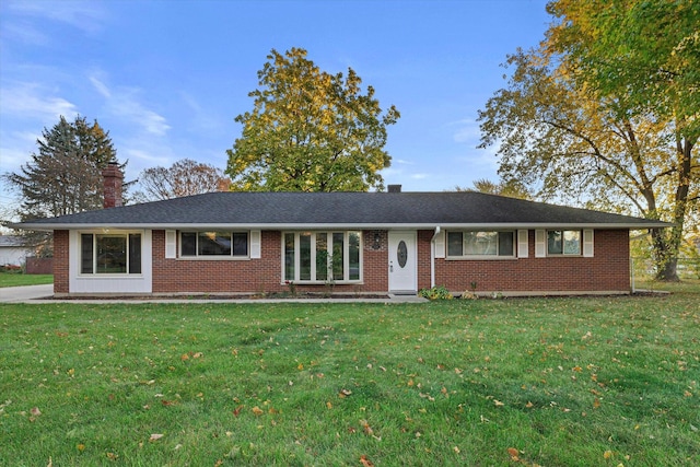 single story home featuring a front yard