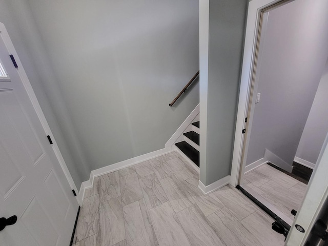 stairway with baseboards