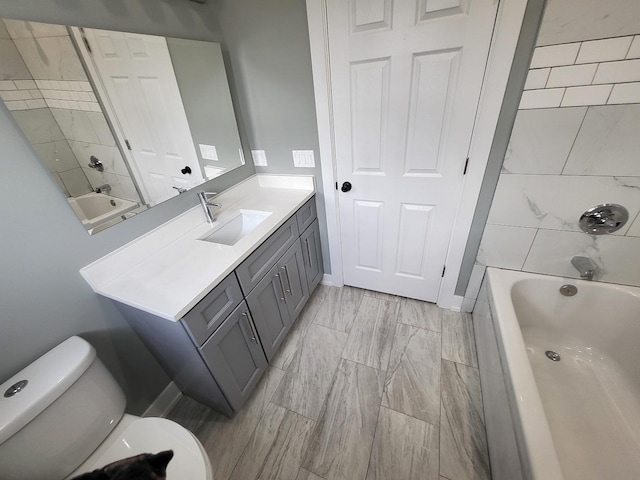 bathroom with toilet, shower / washtub combination, and vanity