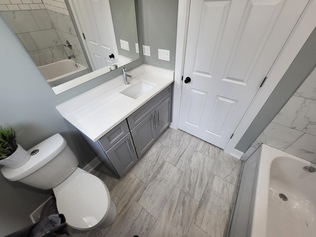 full bathroom featuring toilet, bathing tub / shower combination, and vanity