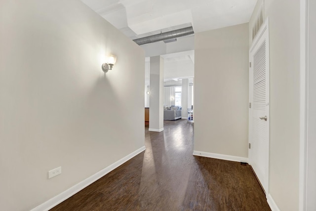 hall with dark wood-type flooring