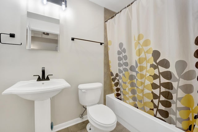 full bathroom featuring sink, toilet, shower / bath combo, and tile patterned flooring