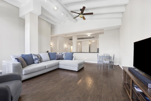 living room with ceiling fan, dark hardwood / wood-style flooring, beamed ceiling, and rail lighting