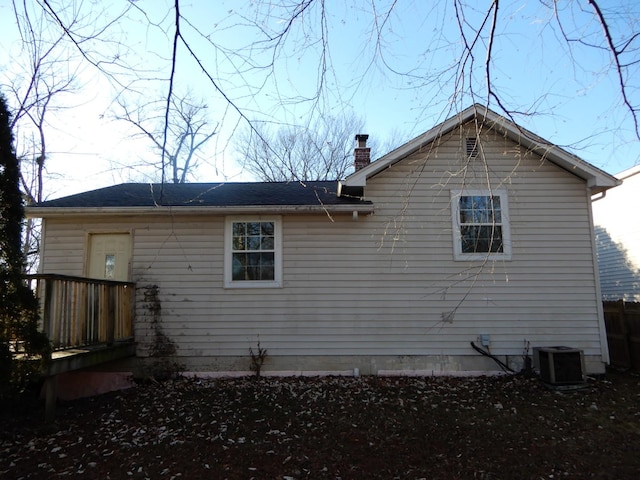 back of house with central AC