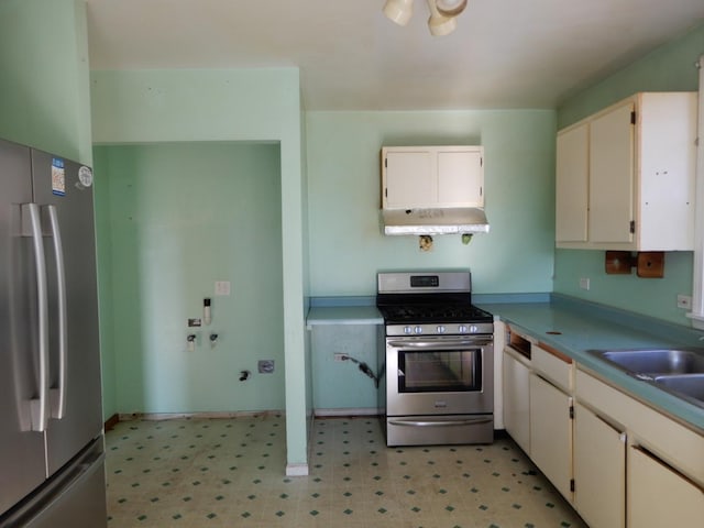 kitchen featuring sink, white cabinetry, and stainless steel appliances