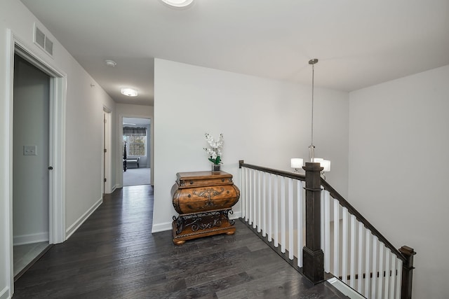 hall with dark hardwood / wood-style flooring