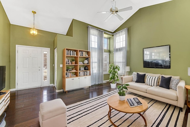 living room with ceiling fan, dark hardwood / wood-style flooring, and lofted ceiling