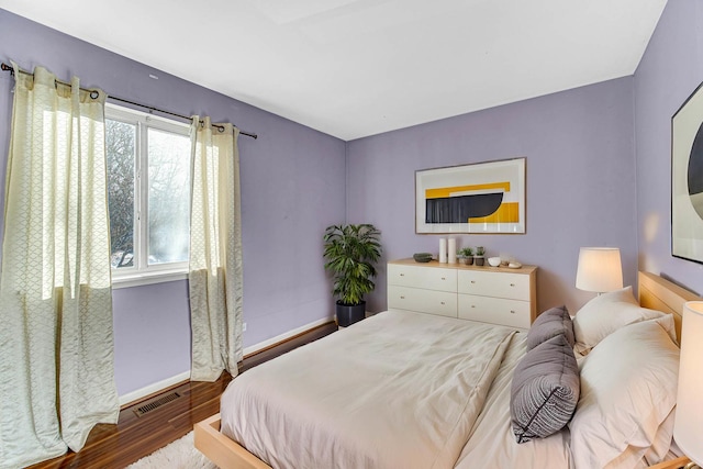 bedroom with hardwood / wood-style floors