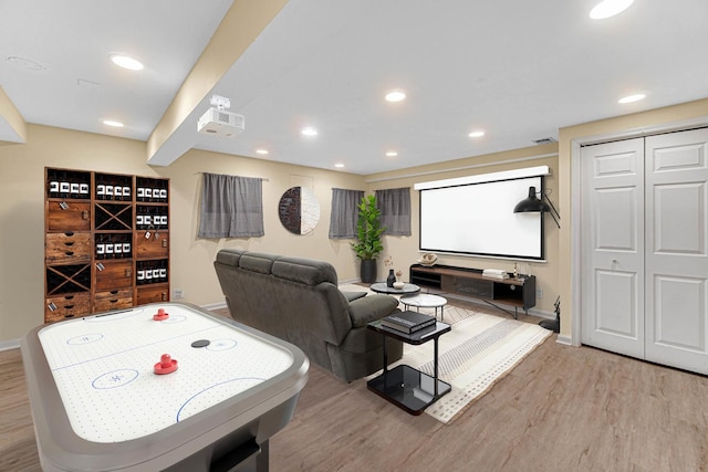 home theater room featuring hardwood / wood-style floors