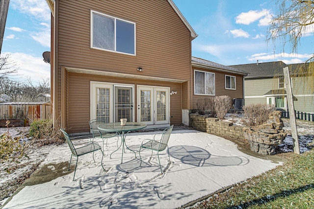 rear view of house with a patio area and french doors